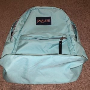 Mint with black and grey jansport backpack